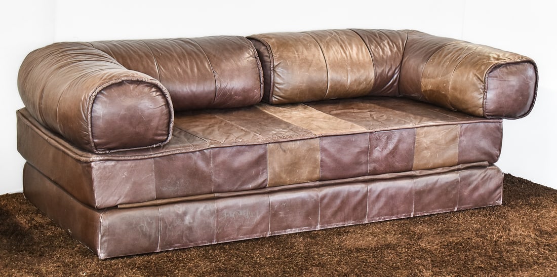 1970s SWISS DE SEDE TEAM LEATHER PATCHWORK SOFA BED DS88: 1970s De Sede Team brown leather patchwork sofa bed DS88, conforming into a queen size bed, and made in Switzerland. The bed measures 27" H x 80" W x 38" D.