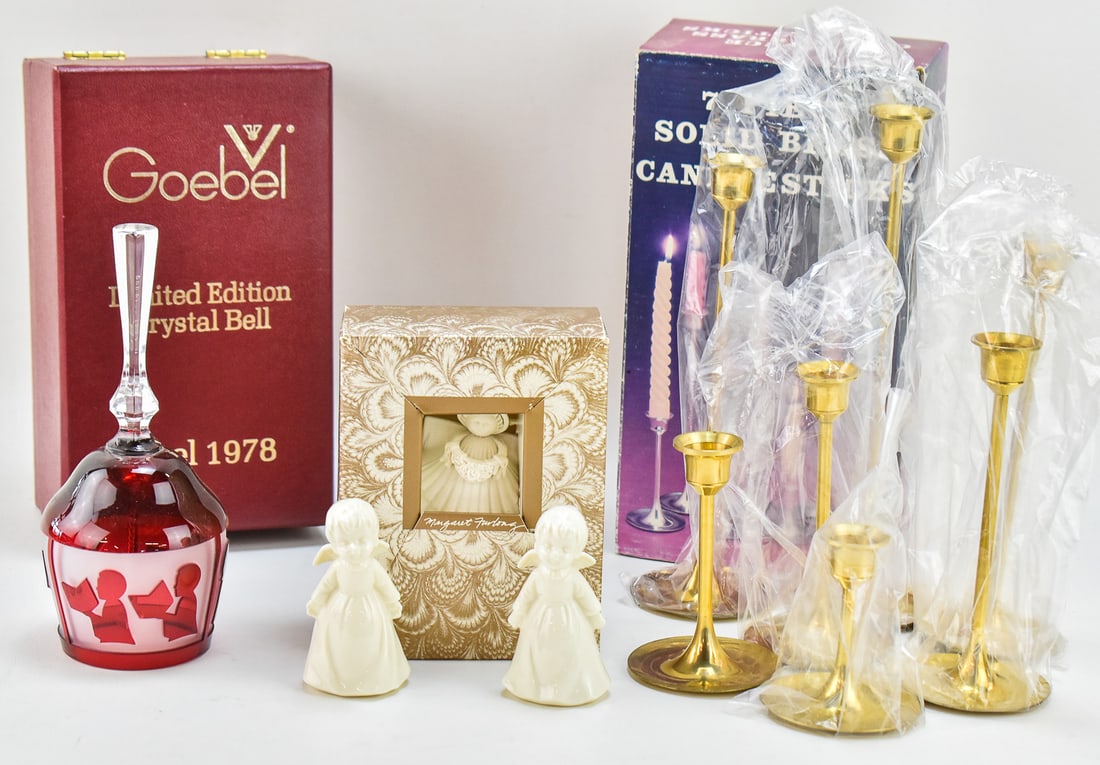 ASSORTED VINTAGE CHRISTMAS DECORATIONS: An assortment of vintage Christmas decorations, including: a pair of porcelain kissing angel figurines, a Margaret Furlong angel ornament, a seven piece solid brass candlestick set, and a Goebel limit