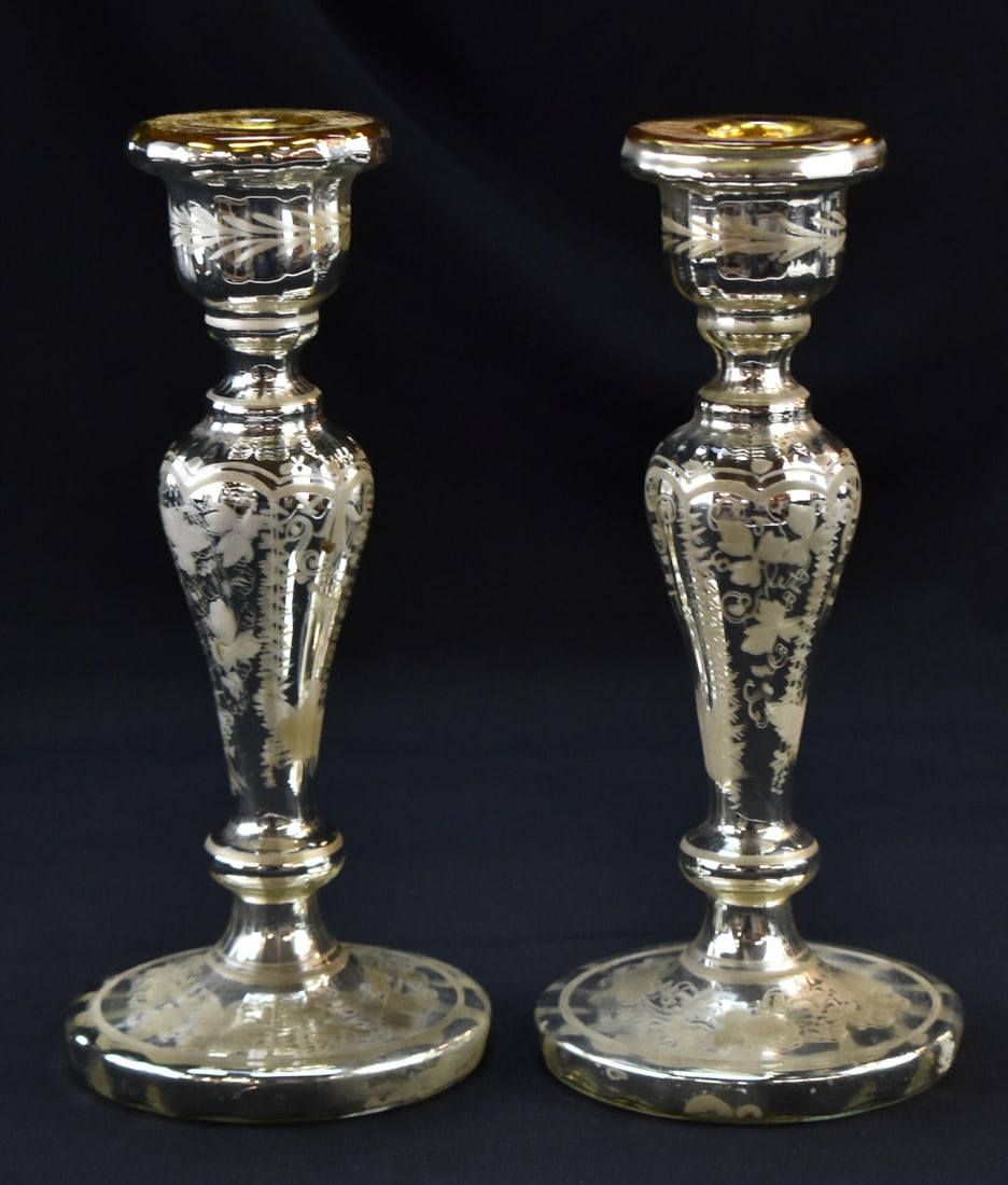 FRENCH MERCURY GLASS BALUSTER-SHAPE CANDLESTICK PAIR: A pair of French hand-blown mercury glass baluster-shape candlesticks with etched floral patterning, circa turn of the 19th century. The item measures 9.5" H, 4.5" W, 4.5" D.