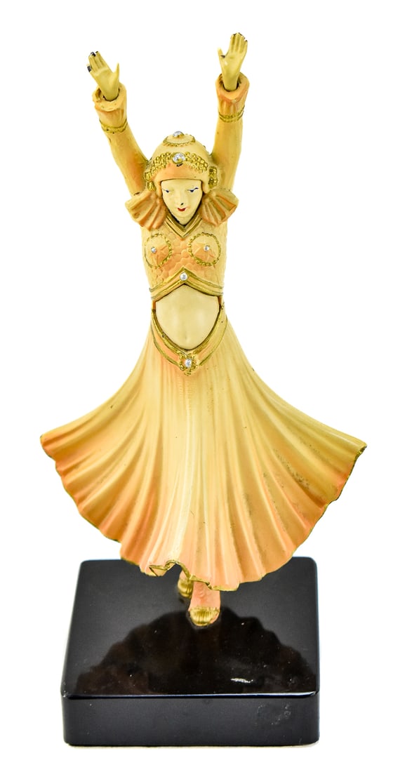 DEMETRE H. CHIPARUS 'HINDU DANCER' STYLE FIGURE: A dancing figure in the style of Demetre H. Chiparus's "Hindu Dancer" on a stand. The item measures 10" H, 5" W, 4" D.