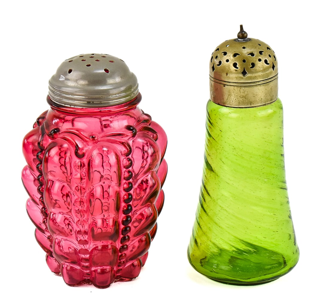 GREEN EAPG MUFFINEER & CONSOLIDATED LAMP & GLASS CO. (ATTR.) CRANBERRY GUTTATE MUFFINEER: This lot includes a green early American pattern glass electroplated nickel silver lidded muffineer and a Consolidated Lamp & Glass Company (attributed) cranberry glass guttate muffineer, circa mi