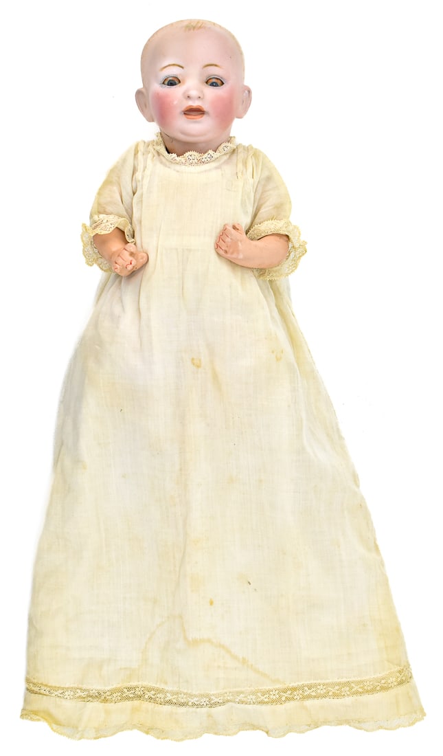 J.D.K. GERMAN BABY DOLL: An early 1900s Kestner sleep eye baby doll with bisque head and composition body, measuring 10" H x 5" W x 3" D.