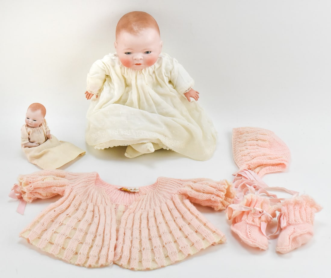 TWO GRACE S. PUTNAM 'BYE LO BABY' DOLLS: A pair of Grace S. Putnam circa 1920s made in Germany "Bye Lo Baby" sleepy eye dolls with bisque heads. The larger doll measures 13" H x 10" W x 5" D.