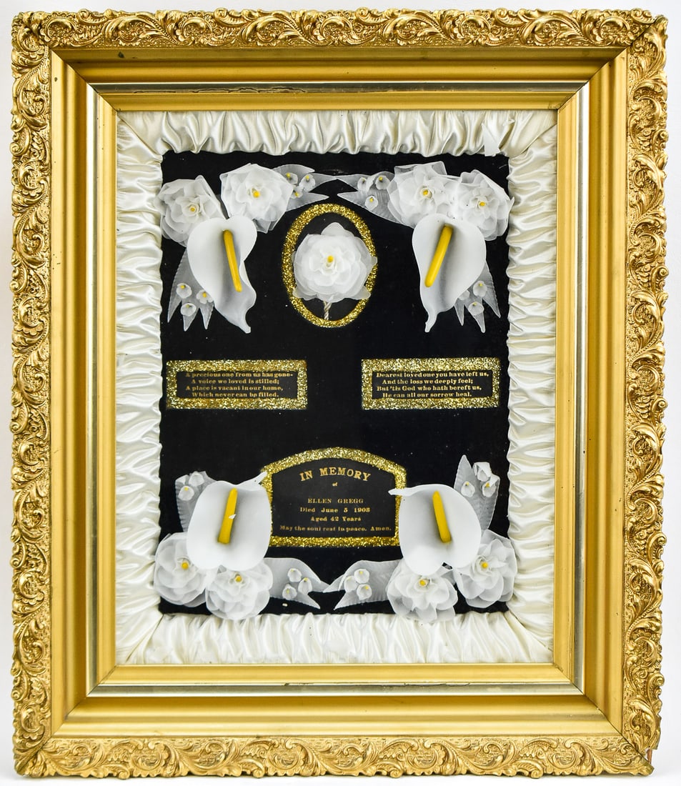 1908 VICTORIAN MEMORIAL MOURNING SHADOWBOX; ELLEN GREGG: A 1908 Victorian memorial mourning gilt shadowbox with floral accents for an Ellen Gregg. The item measures 18.5" H, 15.5" W, 3" D.