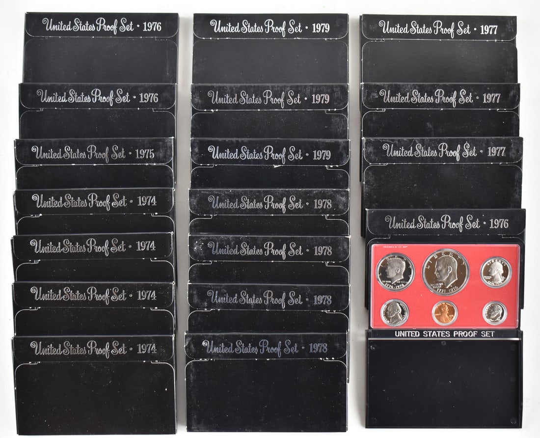 18 U.S. PROOF SETS FROM 1975-1979: Eighteen U.S. proof sets from 1974 (4), 1975 (1), 1976 (3), 1977 (3), 1978 (4), and 1979 (3). Each set comes in a hard plastic case and paper case measuring 3.5" H x 5.5" W x 0.4" D.