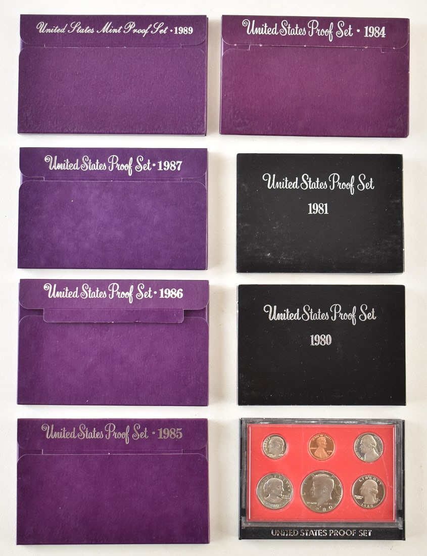 7 U.S. PROOF SETS FROM THE 1980s: An assortment of seven U.S. proof sets from the years 1980, 1981, 1984, 1985, 1986, 1987, and 1989. Each set comes in a hard plastic case and paper case measuring 3.5" H x 5.5" W x 0.4" D.