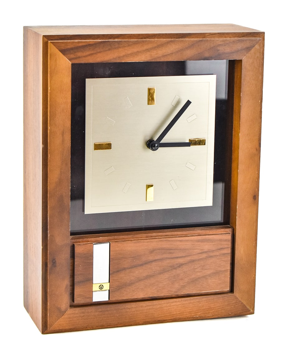 JOSTENS DANISH MODERN STYLE WALL CLOCK: A Jostens Danish Modern style wall clock, circa late 20th century. The item measures 13.5" H, 10.5" W, 4.5" D.
