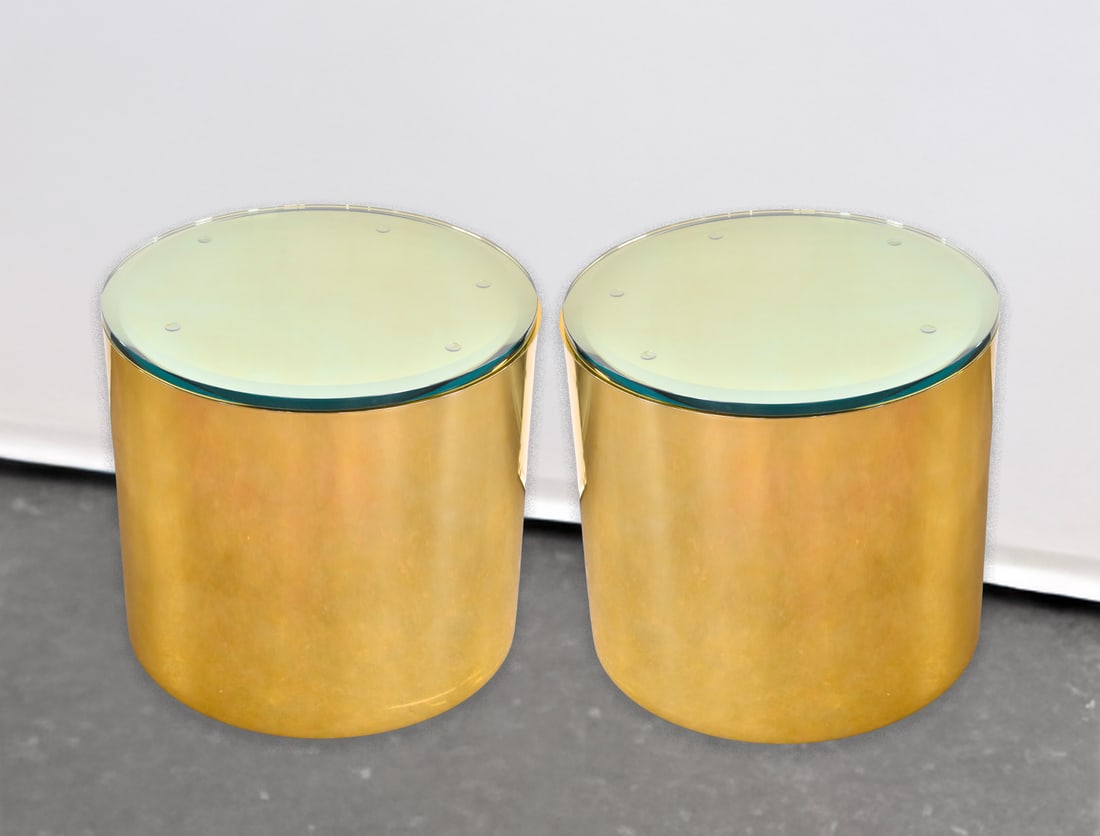 PAIR OF BRASS DRUM GLASS-TOP SIDE TABLES, PAUL MAYEN FOR HABITAT ARCHITECTURAL SUPPLEMENTS: A pair of brass drum glass-top side tables by Paul Mayen for Habitat Architectural Supplements, circa 1970s. Each drum with the top on measures 20.25" H x 22" W x 22" D.