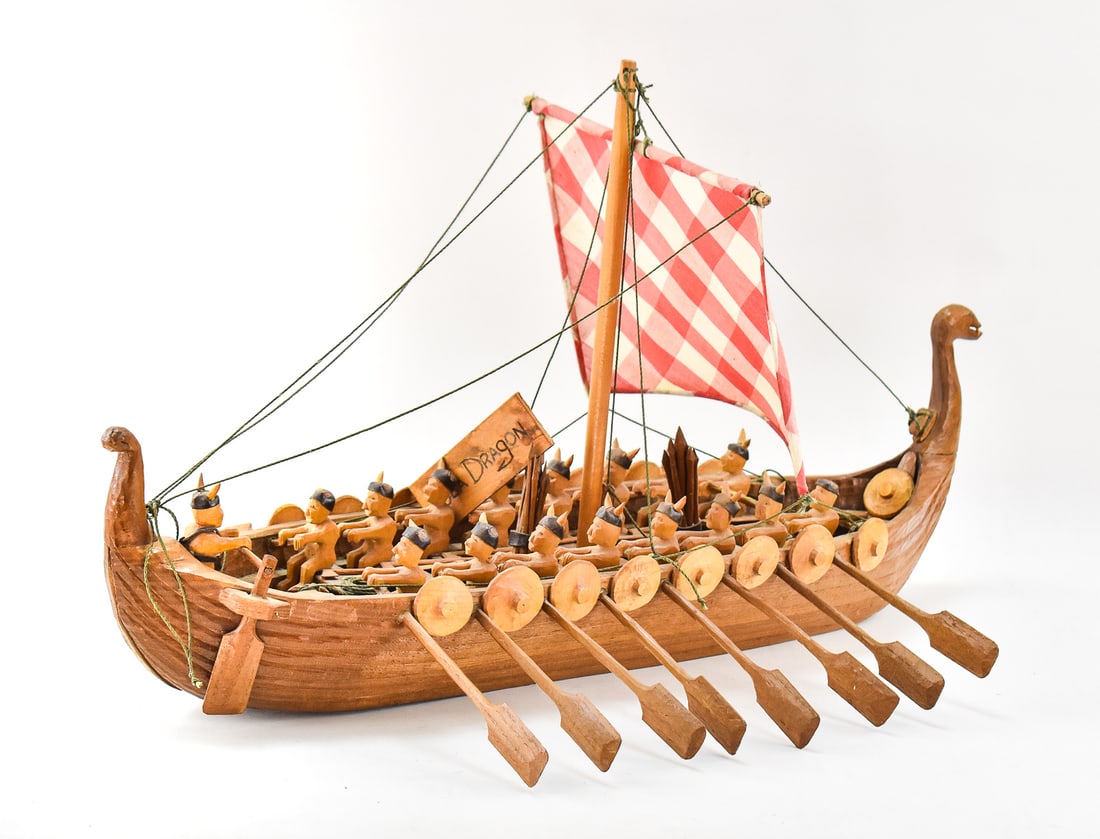 MID-CENTURY HANDMADE NORWEGIAN VIKING SHIP 'SEA DRAGON': Mid-century handmade Norwegian Viking ship the "Sea Dragon" with miniature Vikings rowing the ship. Measures 15" H x 26" L x 18" W overall.