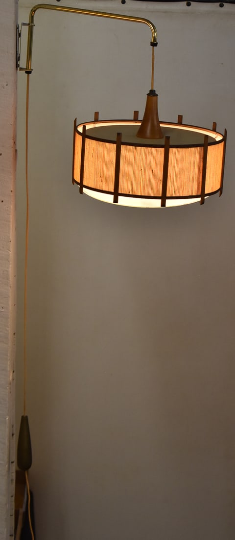 MID-CENTURY TEAK & SISAL ROPE PENDANT LAMP: A Mid-century teak and sisal rope hanging pendant lamp measuring 10"H x 14"W x 14"D.