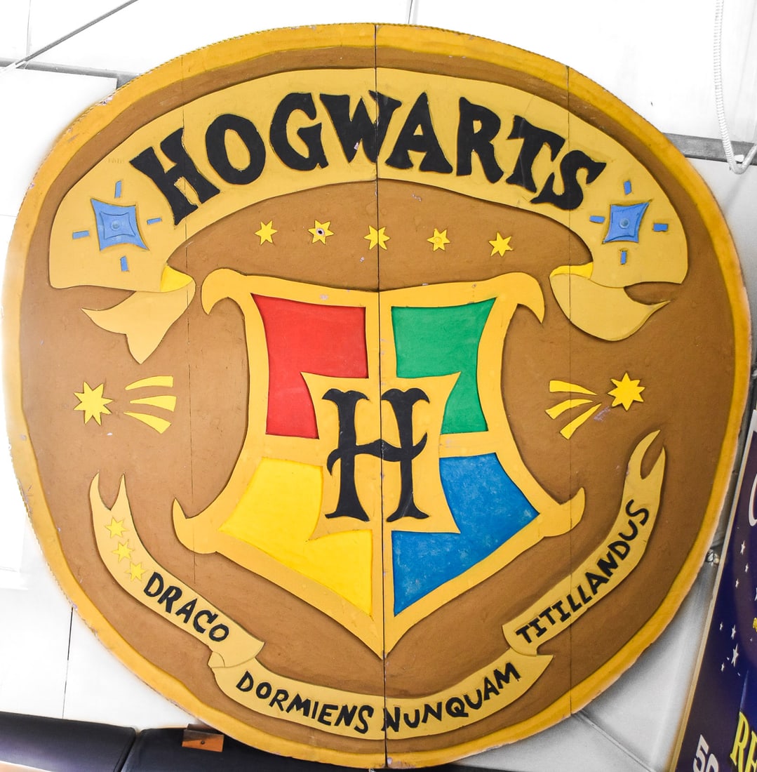 HARRY POTTER HOGWARTS SCHOOL PLAY SIGN: A Harry Potter Hogwarts (unaffiliated to the official brand) foam sign, most likely from a school play. The item measures 96" H, 94" W, 3" D.
