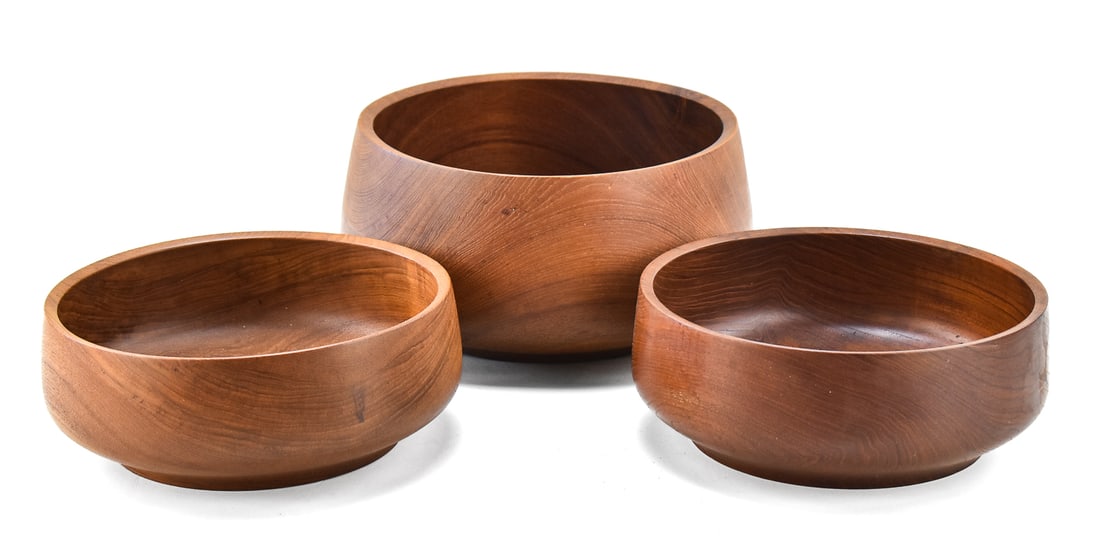 THREE LAURIDS LONBORG MID-CENTURY TEAK SALAD SERVING BOWLS: This lot includes three Laurids Lonborg teak salad serving bowls in various forms, circa 1960s-1970s. The largest item measures 6" H, 11" W, 11" D.