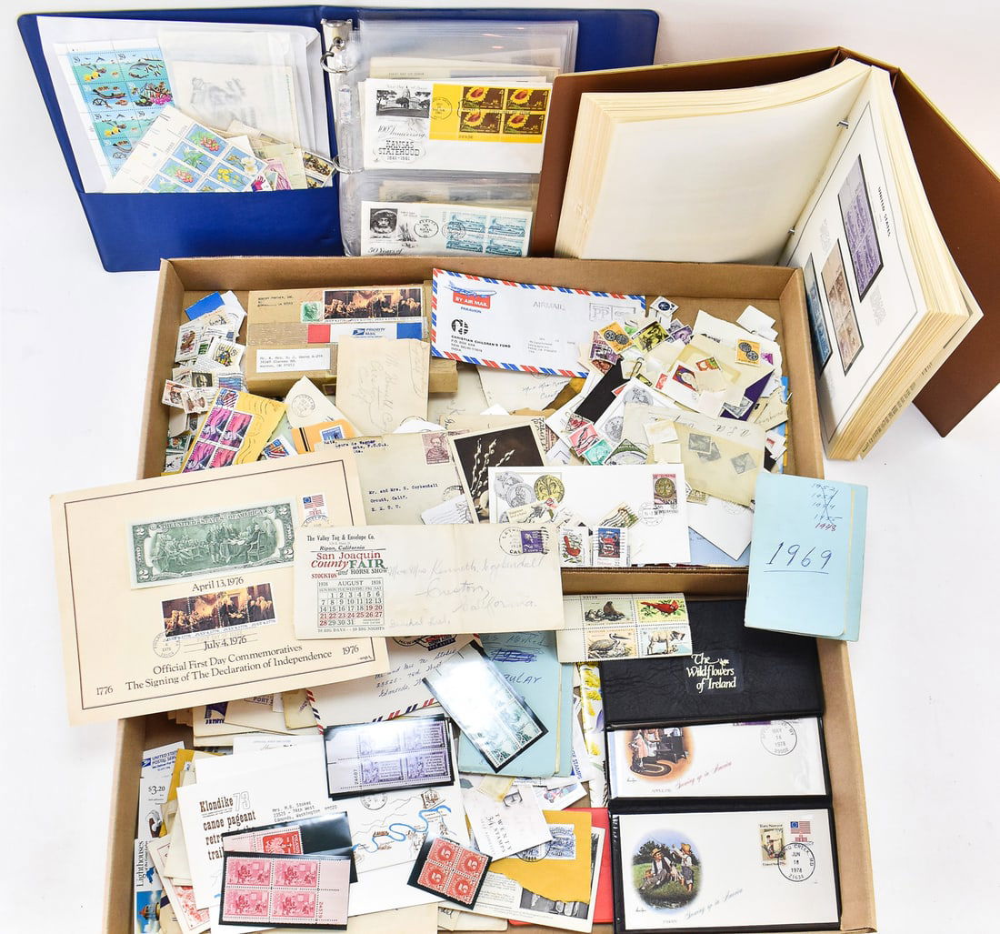 COLLECTION OF 20TH C. INTERNATIONAL & US STAMPS & ENVELOPES: A collection of 20th century international and US stamps and envelopes, including: F. Scott Fitzgerald stamps in a 1998 envelope, 1996 Centennial Olympic games, US stamp albums, etc. The largest