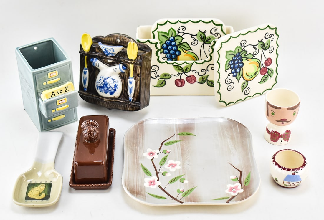 COLLECTION OF MID-CENTURY POTTERY TABLEWARE: A collection of Mid-century pottery tableware including a filing cabinet vase, a turkey butter dish, coasters, a platter, etc. Much of the pottery is made in California. The platter measures 0.75" H