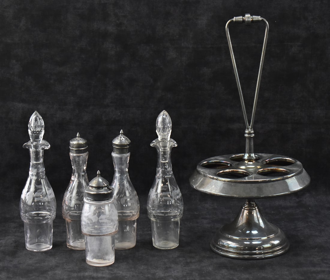 WILCOX SILVERPLATE COMPANY ETCHED GLASS CRUET CAROUSEL: A Wilcox Silverplate Company etched glass cruet carousel, circa late 19th century. The item measures 15" H, 7.5" W, 7.5" D.