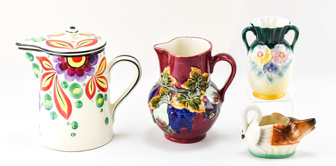 1800s CZECHOSLOVAKIA TWO HEADED GRAVY BOAT & ASSORTED CZECH POTTERY: A collection of Czechoslovakia pottery which includes a 1800s two headed (fox and swan) gravy or sauce boat, a 1930s bohemian porcelain handled vase, a hand painted fruit motif pitcher, and a Ditmar