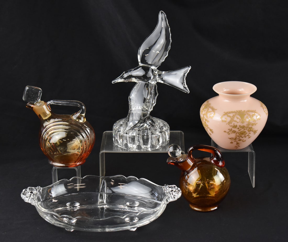 COLLECTION OF CAMBRIDGE; OIL DECANTERS, CROWN TUSCAN VASE & MORE: A collection of Cambridge Glass which includes two amber oil decanters, a Crown Tuscany gold encrusted pink vase, a clear glass gull, and figural frog measuring 9.5" H x 6" W x 4.25" D and a relish