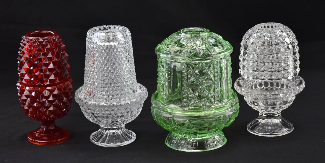 FOUR FAIRY LAMPS: INDIANA GLASS, DUNCAN MILLER, & L. G. WRIGHT: A collection of four fairy lamps including a green glass fairy lamp in the "Stars and Bars" pattern by Indiana Glass Company circa mid-20th century, India Glass Company cadmium glass "Diamond Point"