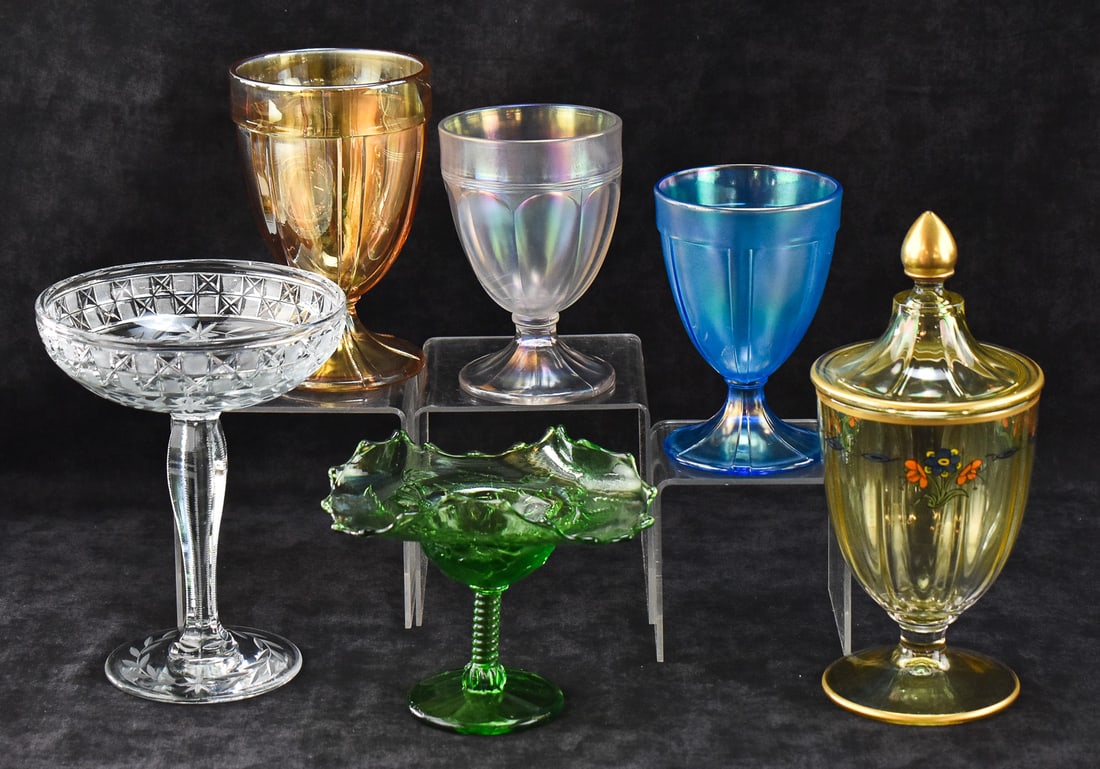 CANDY JARS AND COMPOTE: FENTON, NORTHWOOD (ATTR.), HEISEY (ATTR.): This lot includes Fenton Celeste Blue stretch candy jar base, white iridescent stretch candy jar base, marigold candy jar base; Northwood (attributed) wildflower compote, cut and etched glass floral