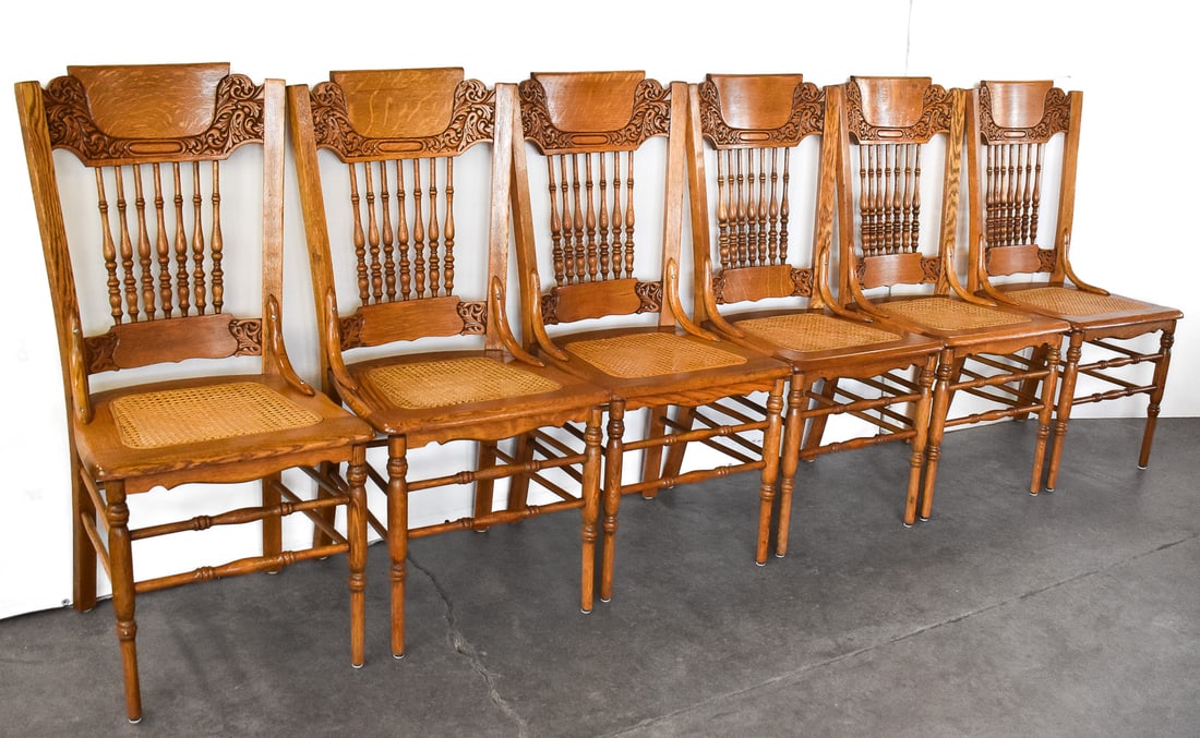 SET OF SIX VICTORIAN OAK & CANE PRESSED-BACK DINING CHAIRS: A set of six late 1800s Victorian oak and cane pressed-back dining chairs measuring 39.5" H x 18" W x 17" D each.