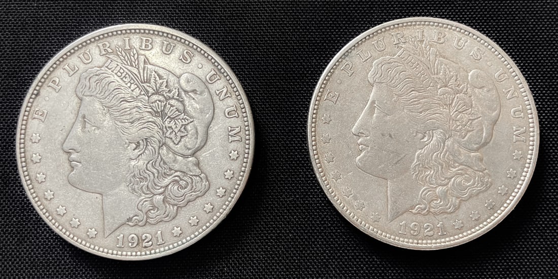 PAIR OF 1921-D MORGAN SILVER DOLLARS: A pair of 1921-D Morgan silver dollars minted in Denver. Both silver dollars are struck in 90% silver with each having a weight of approximately 26.7 grams.