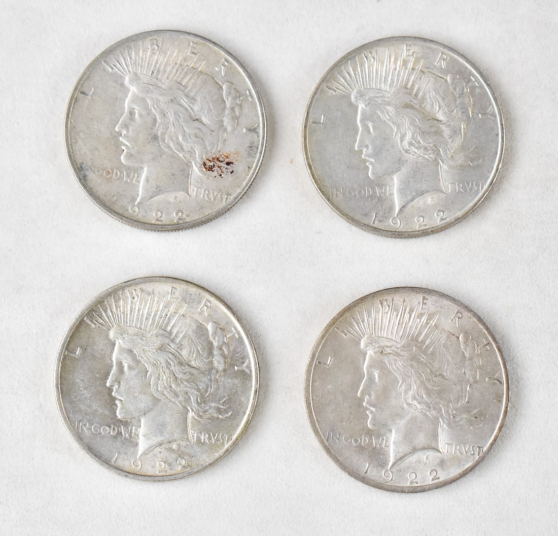 4 1922 PEACE DOLLARS: Four 1922 Peace Dollars minted in Philadelphia. Each coin is struck in 90% silver and has an approximate weight of 26.7 grams.