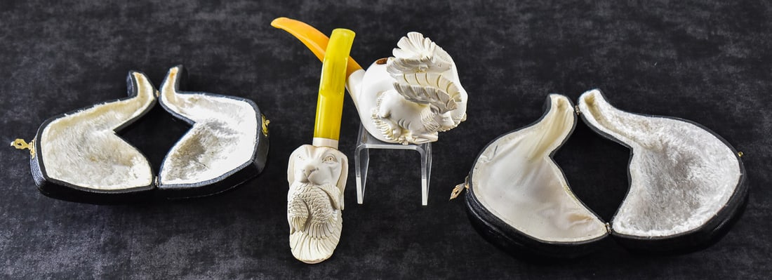 TWO MEERSCHAUM ESTATE PIPES: FIGURAL DOG AND STAG PAIR: This lot includes two meerschaum estate pipes: figural dog and stag pair. The largest item measures 2.5" H, 8" W, 4" D.