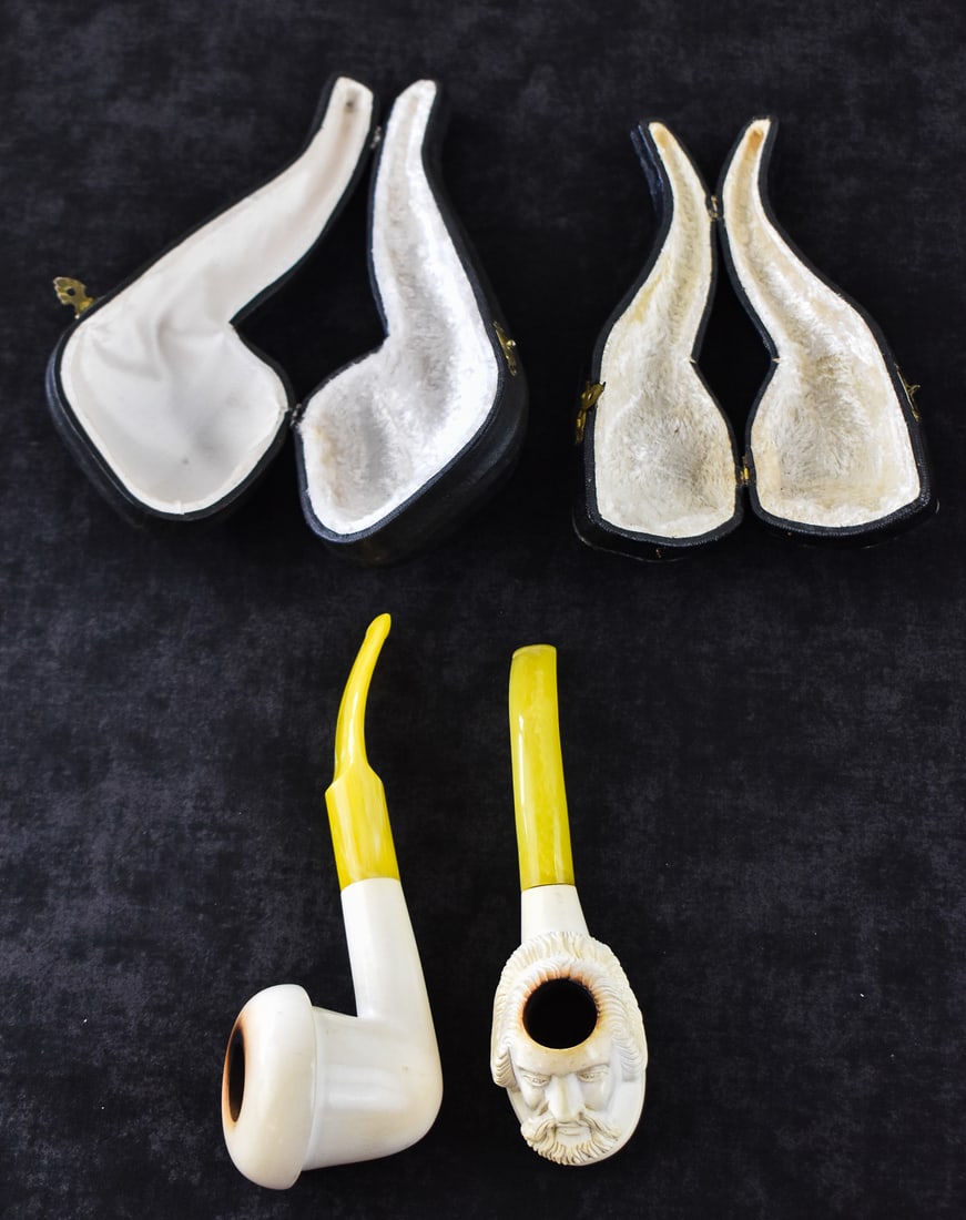 TWO MEERSCHAUM ESTATE PIPES: MAN & CALABASH: This lot includes two meerschaum estate pipes: figural man which appears to be William Shakespeare and a calabash block pipe. The largest item measures 2.5" H, 8" W, 4" D.