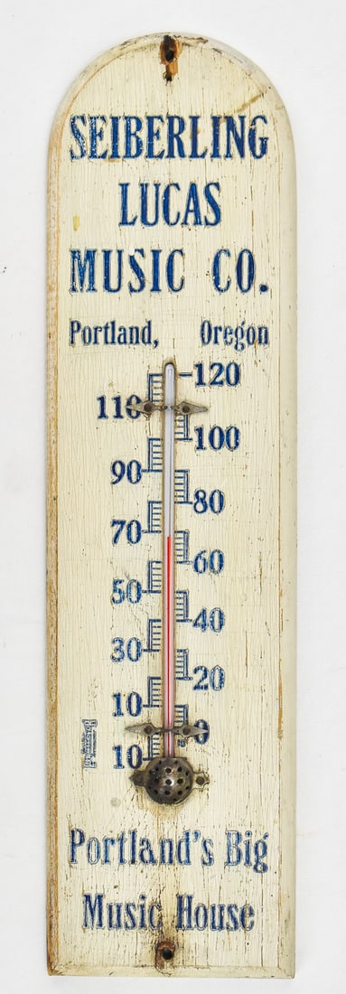 SEIBERLING LUCAS MUSIC CO. THERMOMETER: A wood advertising thermometer from the Seiberling Lucas Music Company of Portland Oregon, "Portland's Big Music House", circa 1902-1932. The thermometer measures 15" H x 4" W x 1" D.