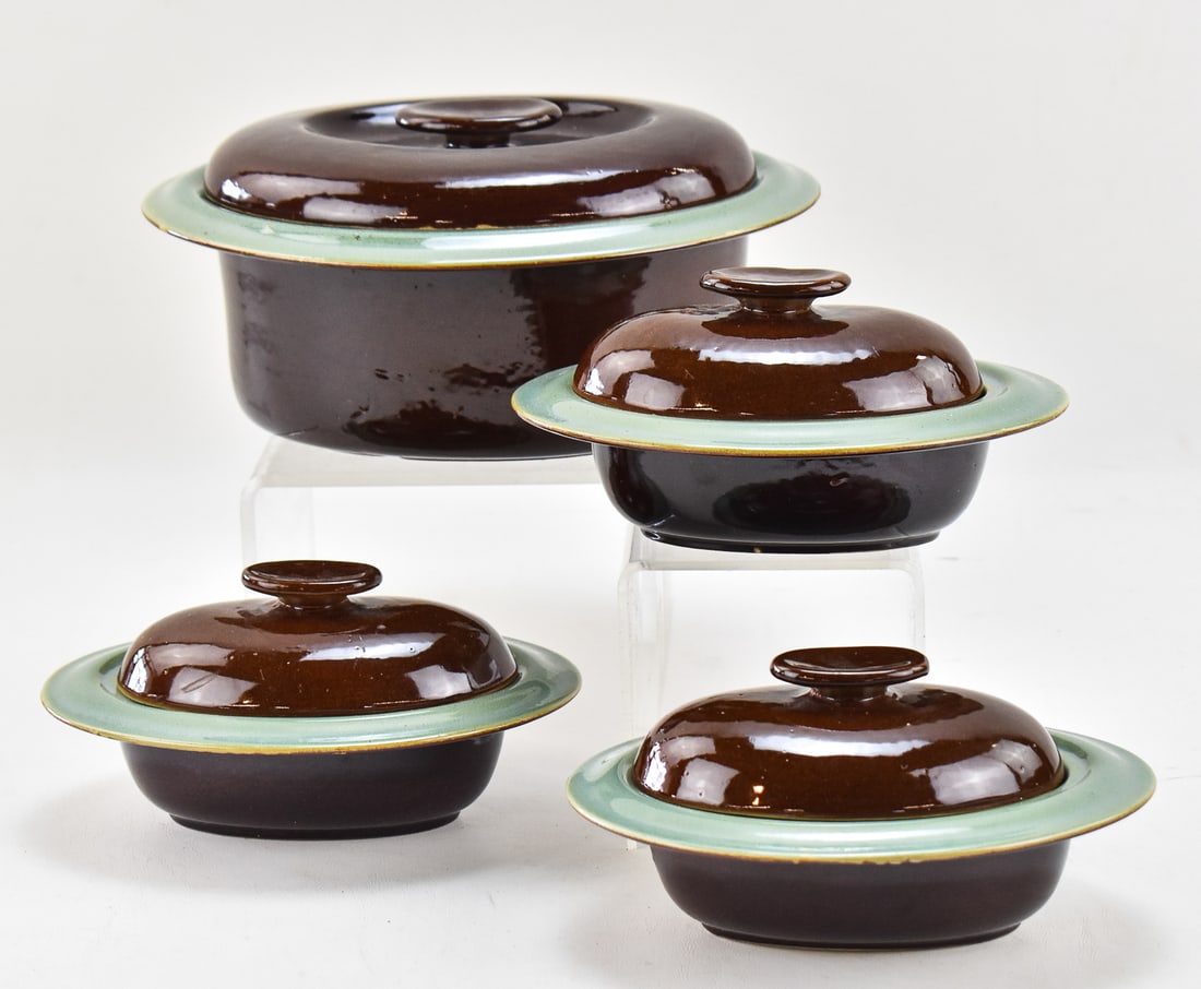 RED WING 'OOMPH' BAKEWARE: LIDDED CASSEROLE AND NAPPIES: This lot includes the following Red Wing Potteries "Oomph" earthenware bakeware pieces, circa 1943: lidded casserole and three lidded nappies. The largest item measures 5" H, 10" W, 8.5" D.