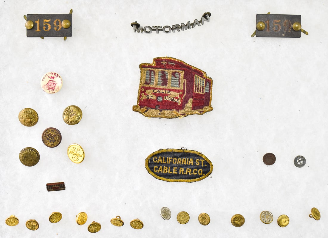 EARLY 20TH CENTURY CABLE CAR RELATED ITEMS & MORE: BADGES, BUTTONS, & PATCHES: This lot includes the following cable car related items and more: two "159" number badges, "Motorman" skeleton conductor uniform badge, nine San Francisco Municipal Railway uniform buttons, San Franci