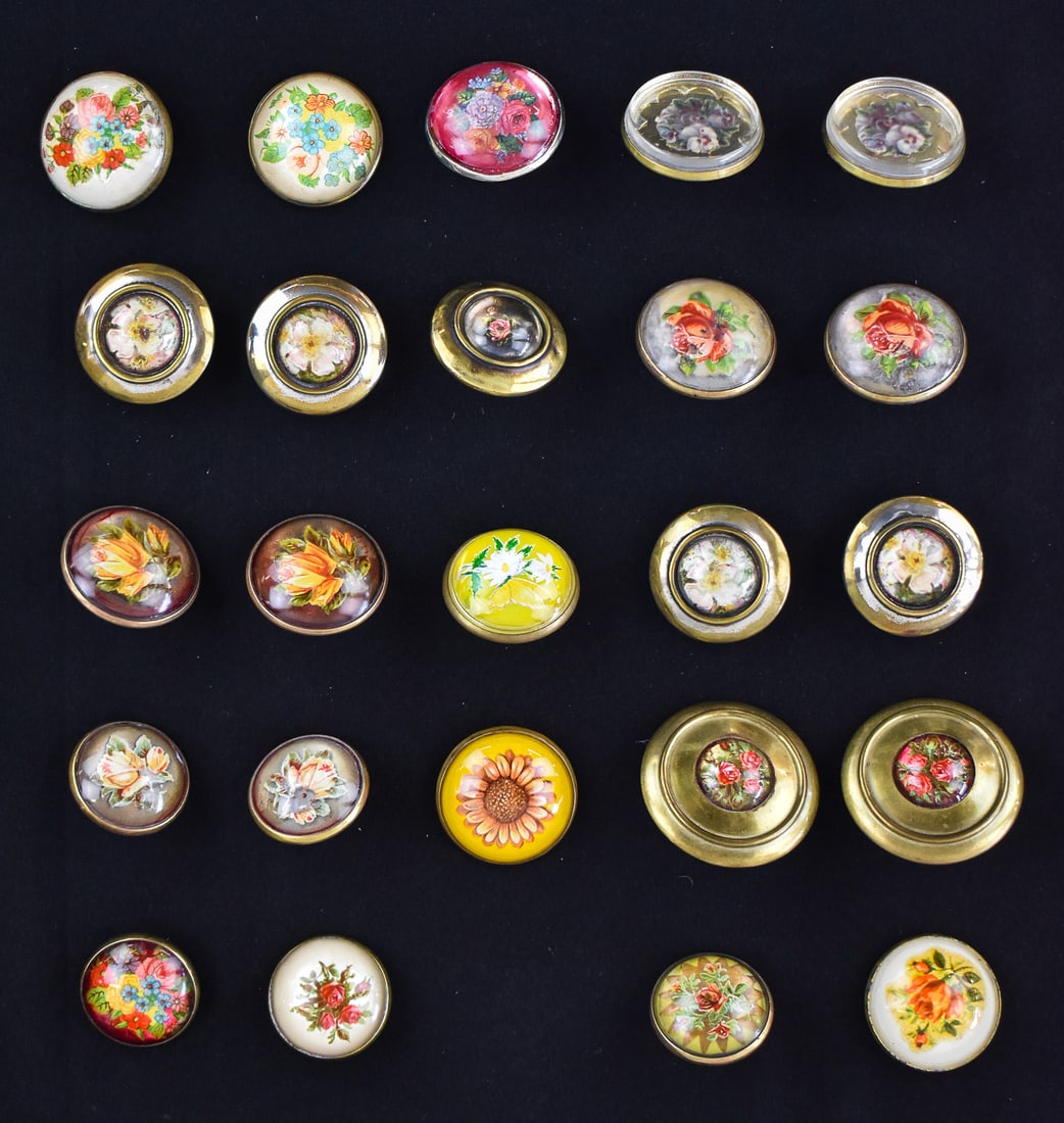COLLECTION OF ANTIQUE HORSE BRIDLE DOMED FLORAL ROSETTES: A collection of twenty-four antique horse bridle domed floral rosettes. There are eight pairs and eight singles. The largest set measures 2.25" H x 2.25" W x 1" D.