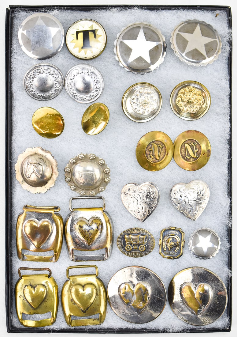 ANTIQUE SILVER & BRASS HORSE BRIDLE ROSETTES AND BUCKLES: Twenty-five antique silver and brass horse bridle rosettes and buckles in pairs and singles, with some dating back to the Civil War. The largest rosette pair measures 2.25" H x 2.25" W x 1" D.