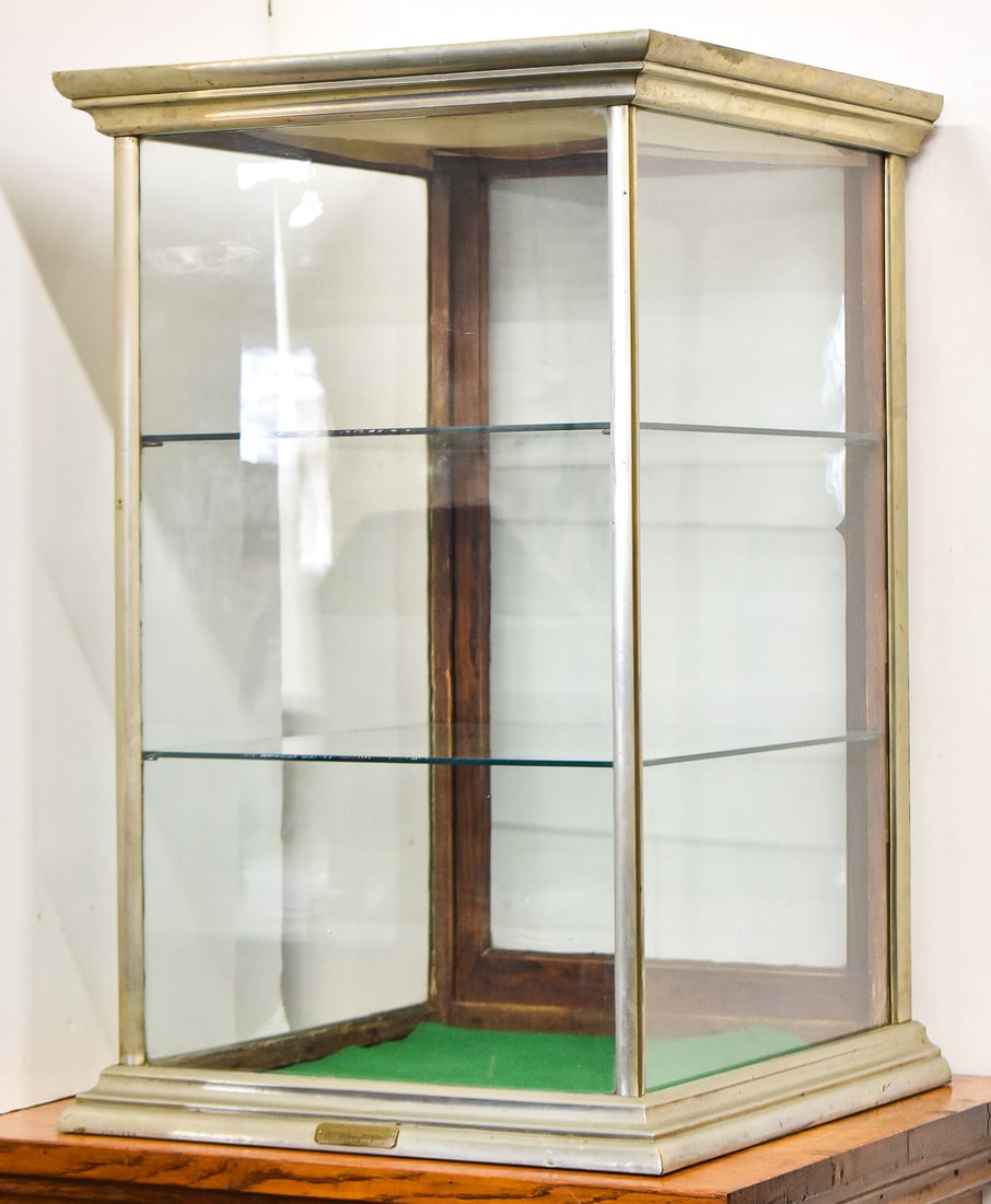 ANTIQUE COHEN DAVIS & CO GLASS & NICKEL GENERAL STORE COUNTERTOP SHOWCASE: Circa early 1900s Cohen Davis & Company Portland, Oregon glass and nickel general store countertop display with glass shelves measuring 32" H x 20" W x 21" D.
