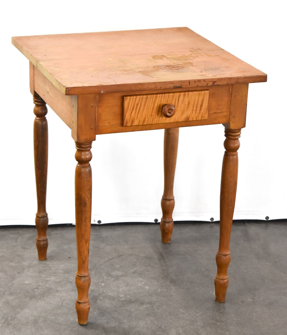 SHERATON-STYLE NIGHSTAND WITH TIGER MAPLE DRAWER, 19TH C.: A Sheraton-style nightstand with a single drawer made of tiger maple and turned legs, circa 19th century. The nightstand measures 29" H x 23" W x 23" D.