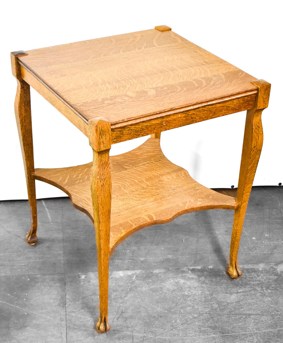 QUARTER-SAWN OAK SIDE TABLE, LATE 19TH CENTURY: A quarter-sawn oak side table with claw feet, circa late 19th century. The table measures 28.5" H x 22.5" W x 22.5" D