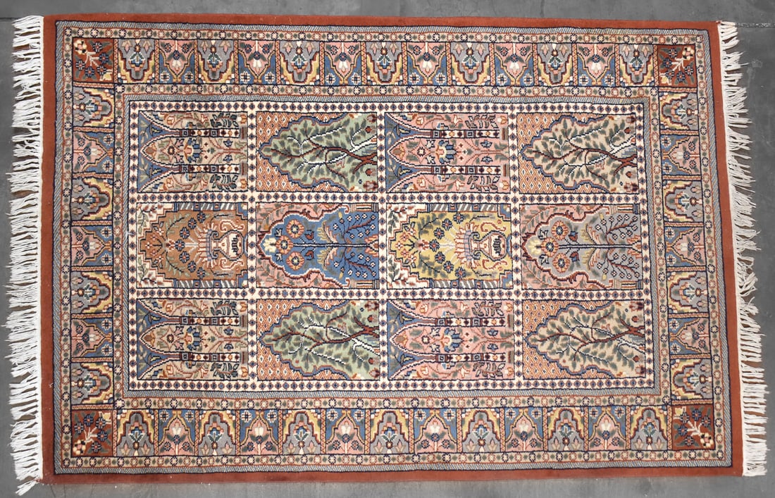 KASHMIR PERSIAN PANELLED RUG: A Kashmir-style Persian paneled Khesti layout with compartments containing symbolic motifs. The rug measures 75" L x 48" D.