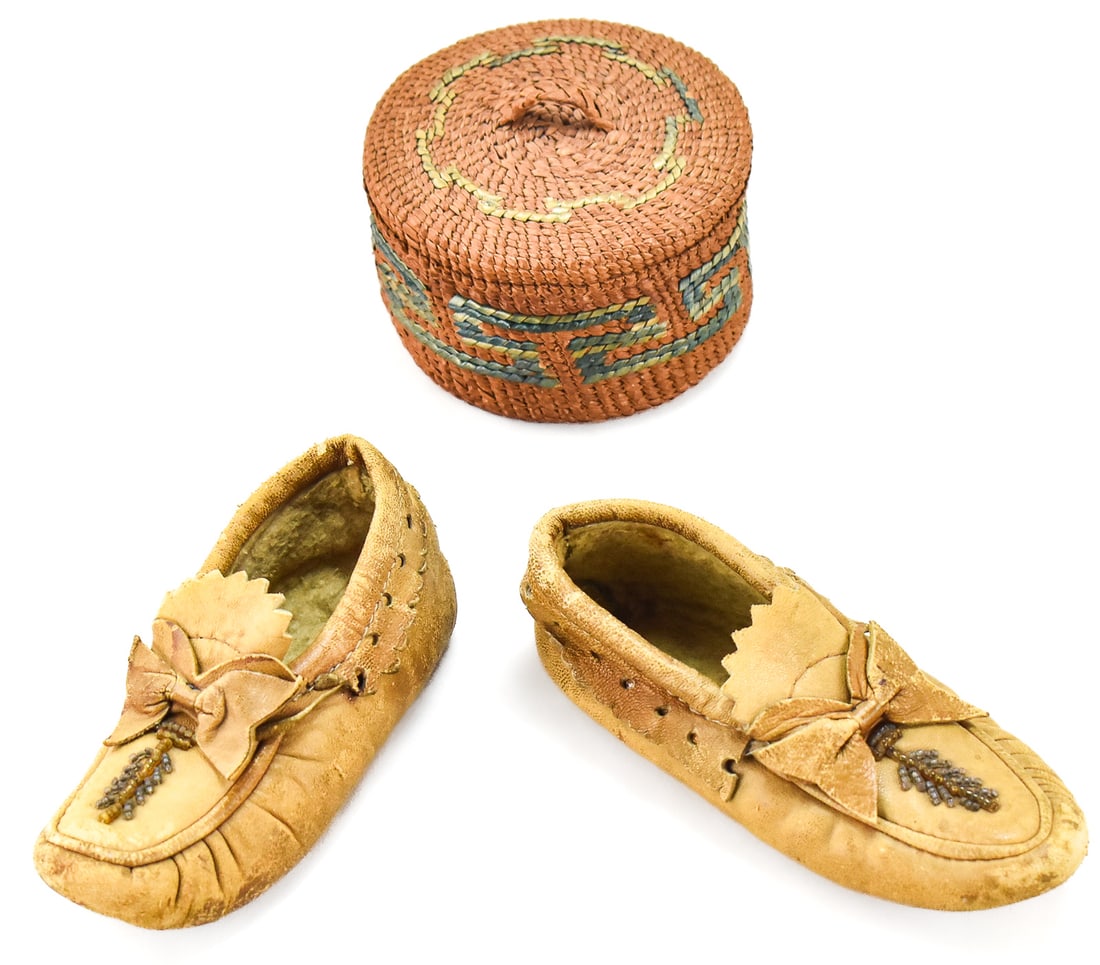 NORTHWEST COAST FIRST NATIONS WOVEN BASKET AND CHILD'S BEADED MOCCASIN PAIR: This lot includes a Northwest Coast First Nations (likely, Tsimshian) woven basket and a child's pair of beaded moccasins, circa early 20th century. The largest item measures 2.5" H, 4" W, 4" D.