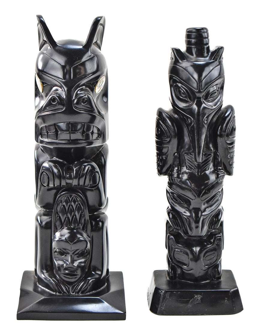 TWO CONTEMPORARY NORTHWEST COAST TOTEM POLES: THORN ARTS OF CANADA: This lot includes two contemporary Northwest Coast style totem poles: one is signed by Thorn Arts of Canada and the other is of a Haida style. The largest item measures 14.5" H, 5.5" W, 4.5" D.