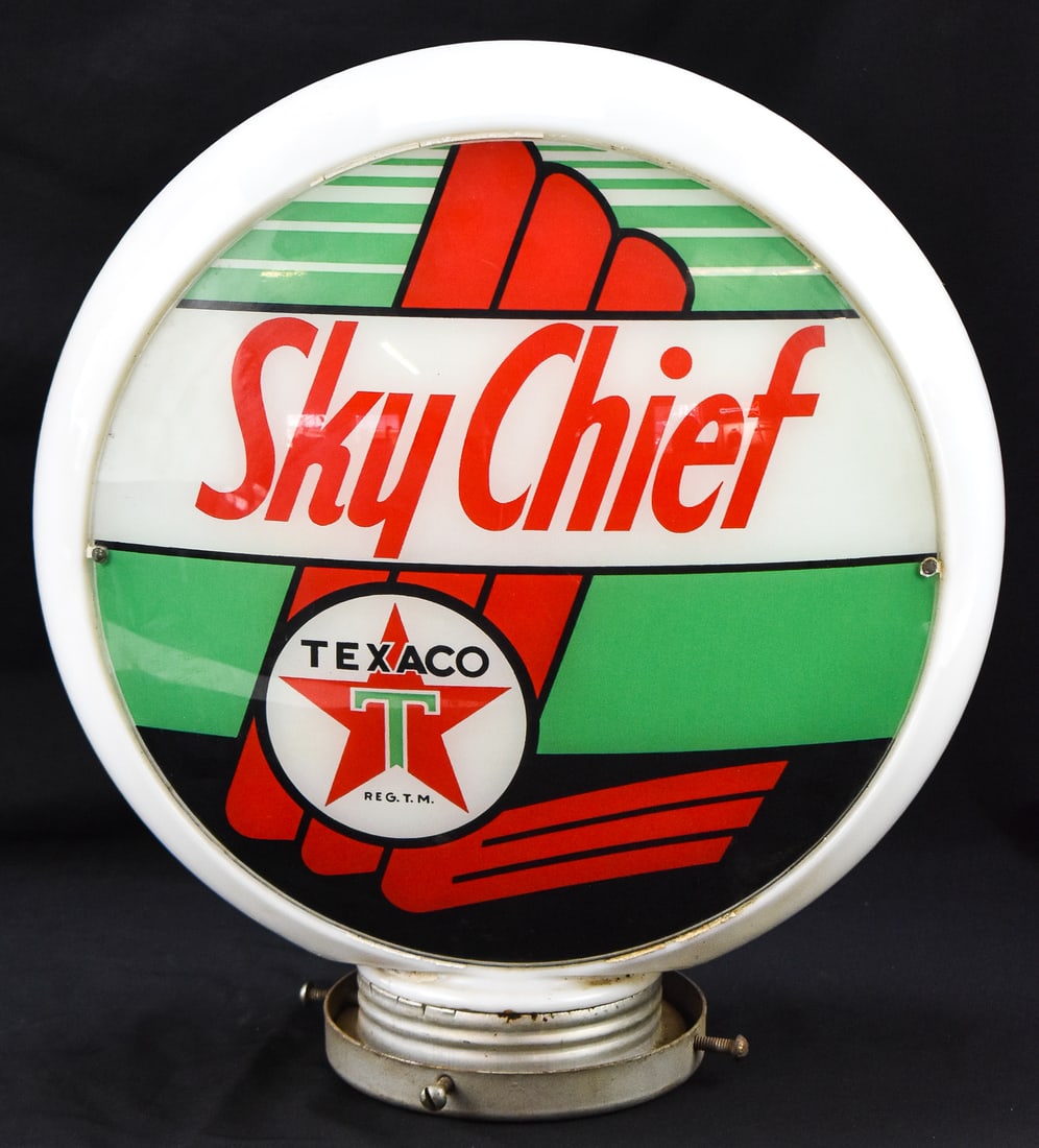 TEXACO SKY CHIEF MILK GLASS GAS PUMP GLOBE: A Texaco Sky Chief double-sided milk glass gas pump globe with two lenses, circa 1940s. The item measures 17.5" H, 15.5" W, 5.5" D.
