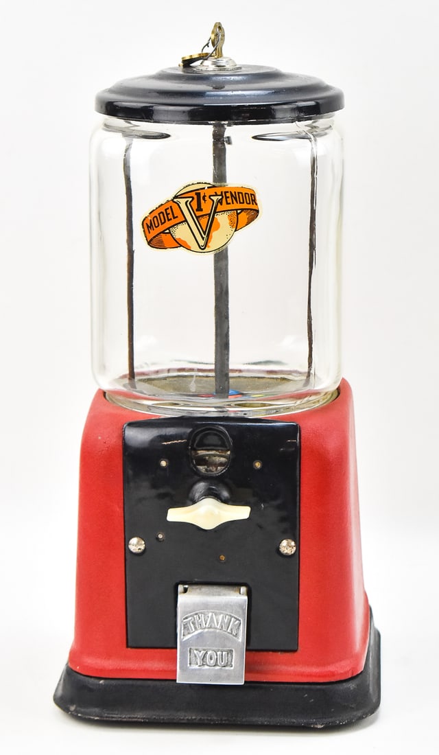 VICTOR MODEL V PENNY VENDING MACHINE: A Victor Model V penny vending machine with a pair of keys, circa early 20th century. The item measures 15" H, 7.5" W, 7.5" D.