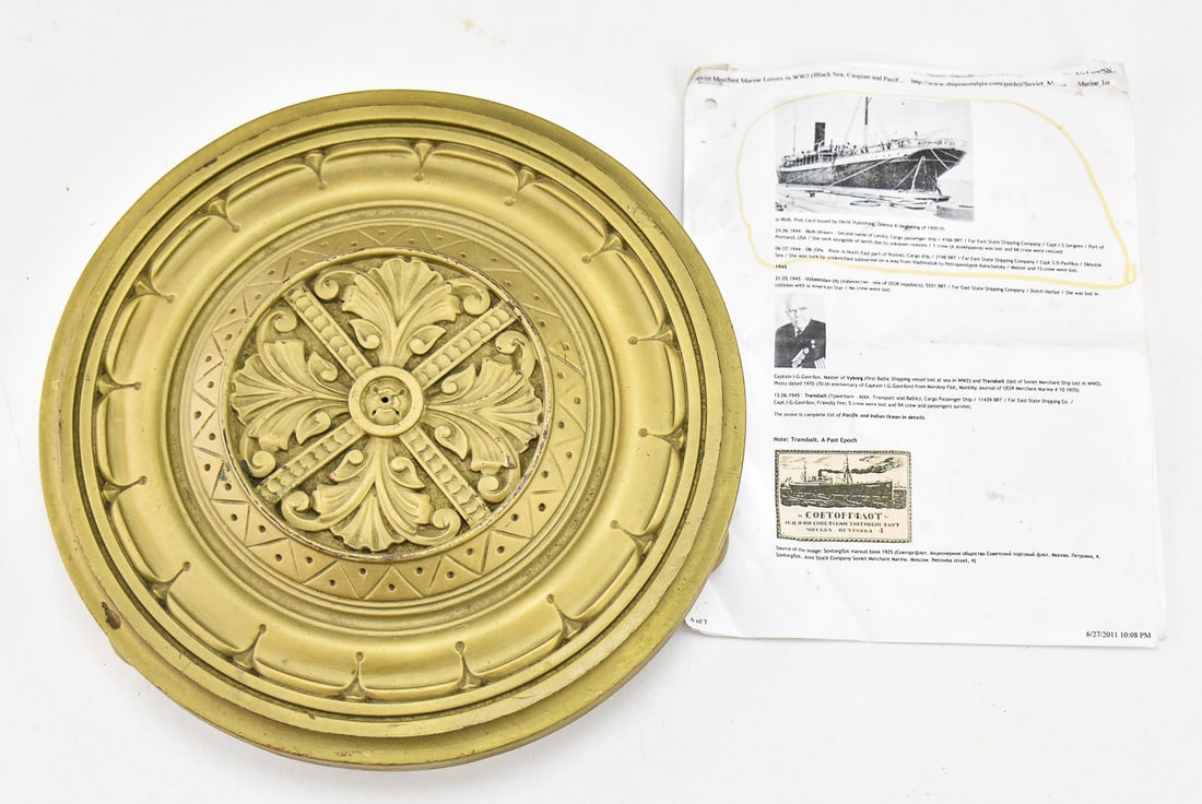 GILT SHIP'S CEILING MEDALLION; TSAR NICHOLAS II'S SHIP - ILLITCH (ATTR.): A gilt wooden ceiling medallion believed to be belonged to Tsar Nicholas II's ship named the "Illitch" which reportedly sunk in Portland, Oregon; circa 1943-1944. The item resting measures 3" H,