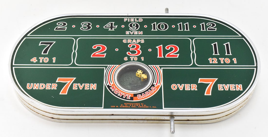 'MONTE CARLO' TABLE-TOP CRAPS DICE GAME BY H. C. EVANS CO., C. 1940s: A "Monte Carlo" branded table-top craps dice game produced by the H. C. Evans Company of Chicago, Illinois, circa 1940's. The game measures 12" H x 24" W x 2" D.