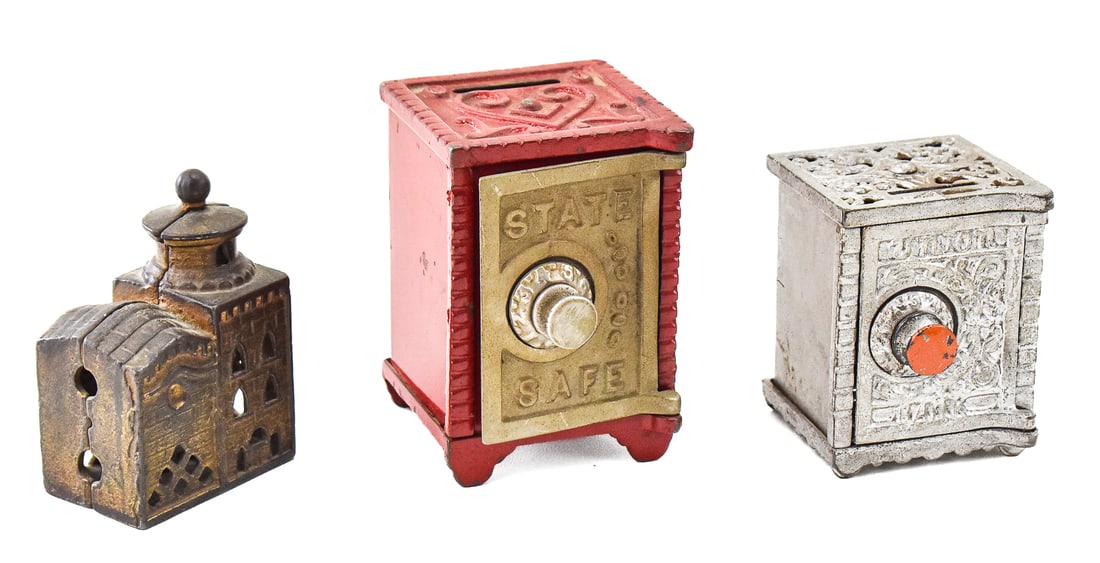 THREE ANTIQUE CAST IRON COIN BANKS: Three antique cast iron and coin banks which includes an A.C. Williams three-story mosque bank, a Union safe-style bank, and a cast iron and painted pressed steel State Safe bank manufactured by