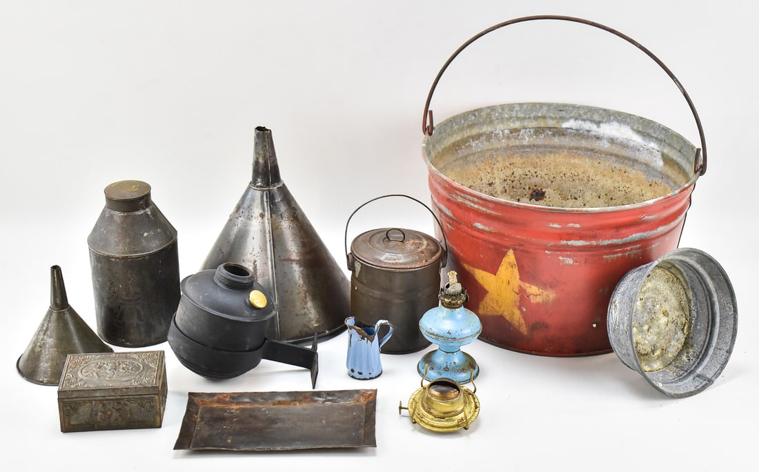ASSORTED ANTIQUE METAL HOUSEHOLD ITEMS: Eleven assorted antique metal household items which includes; two funnels, a small tray, a small enameled oil lantern, a miniature enameled pitcher, a pressed lidded box with a cherub design, a