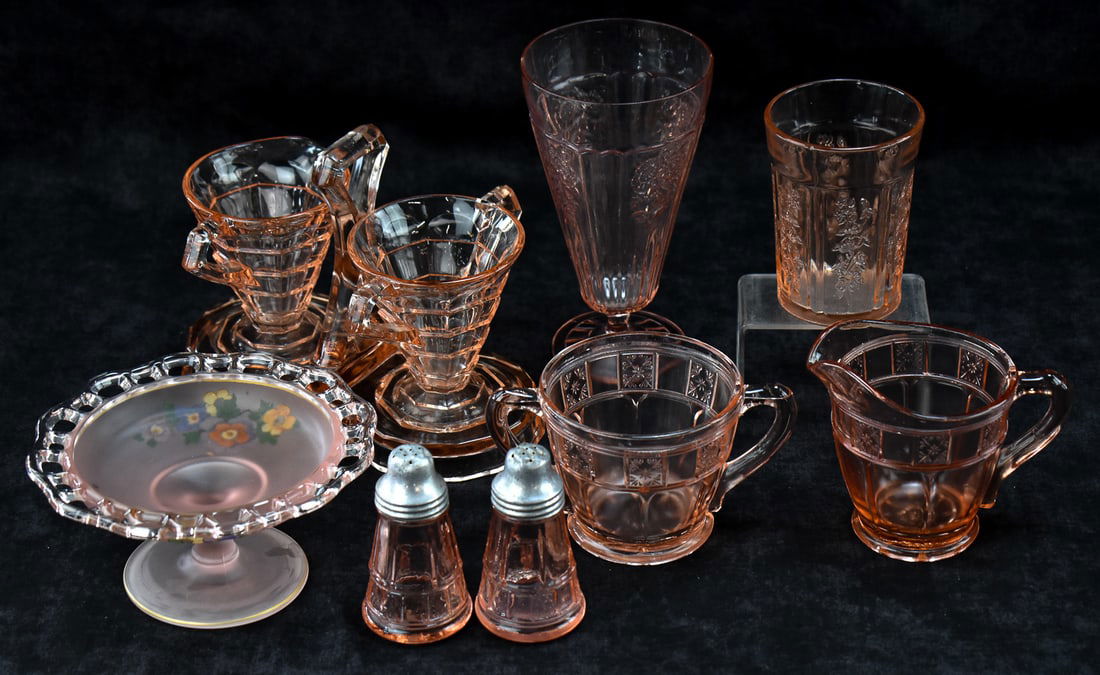 COLLECTION OF PINK DEPRESSION GLASS, INDIANA 'TEA ROOM' & MORE: A collection of pink depression glass which includes a pair of "Doric" salt & pepper shakers, creamer and a sugar bowl, a "Old Colony" satin floral footed compote, a "Sharon" tumbler and goblet,
