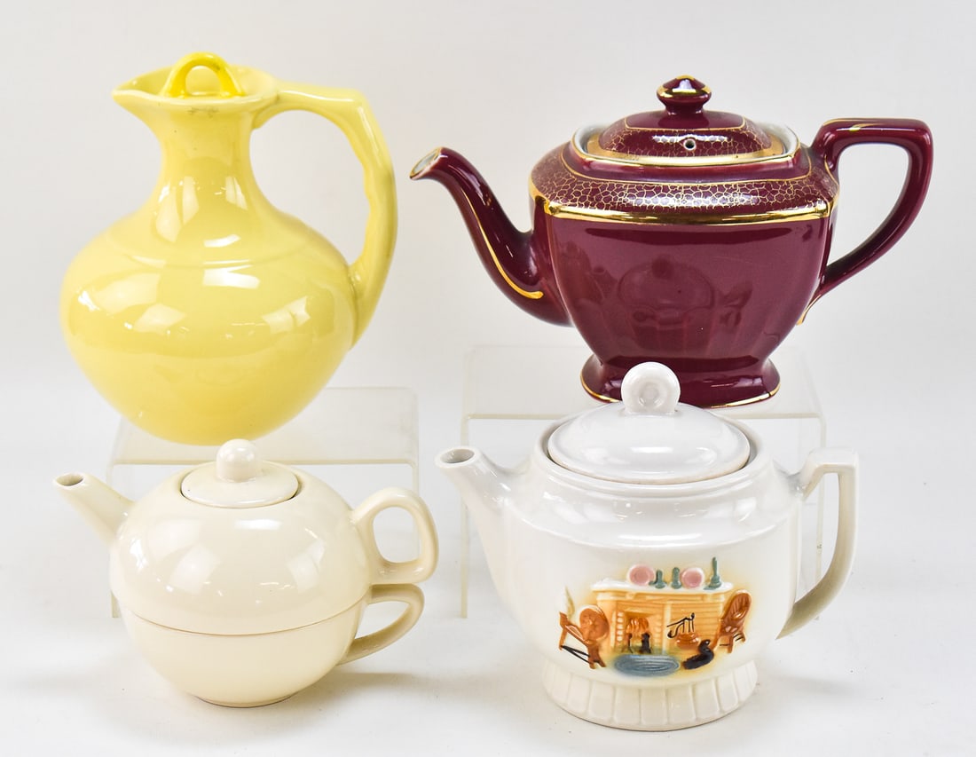 ASSORTMENT OF TEAPOTS & A GLADDING MCBEAN FRANCISCAN POTTERY CARAFE: A Gladding McBean Franciscan Pottery yellow carafe, circa 1930s, a Hall "Hollywood" design teapot, circa mid-20th century, a ceramic tea for one in cream color, and a Porcelier teapot with a hearth sc