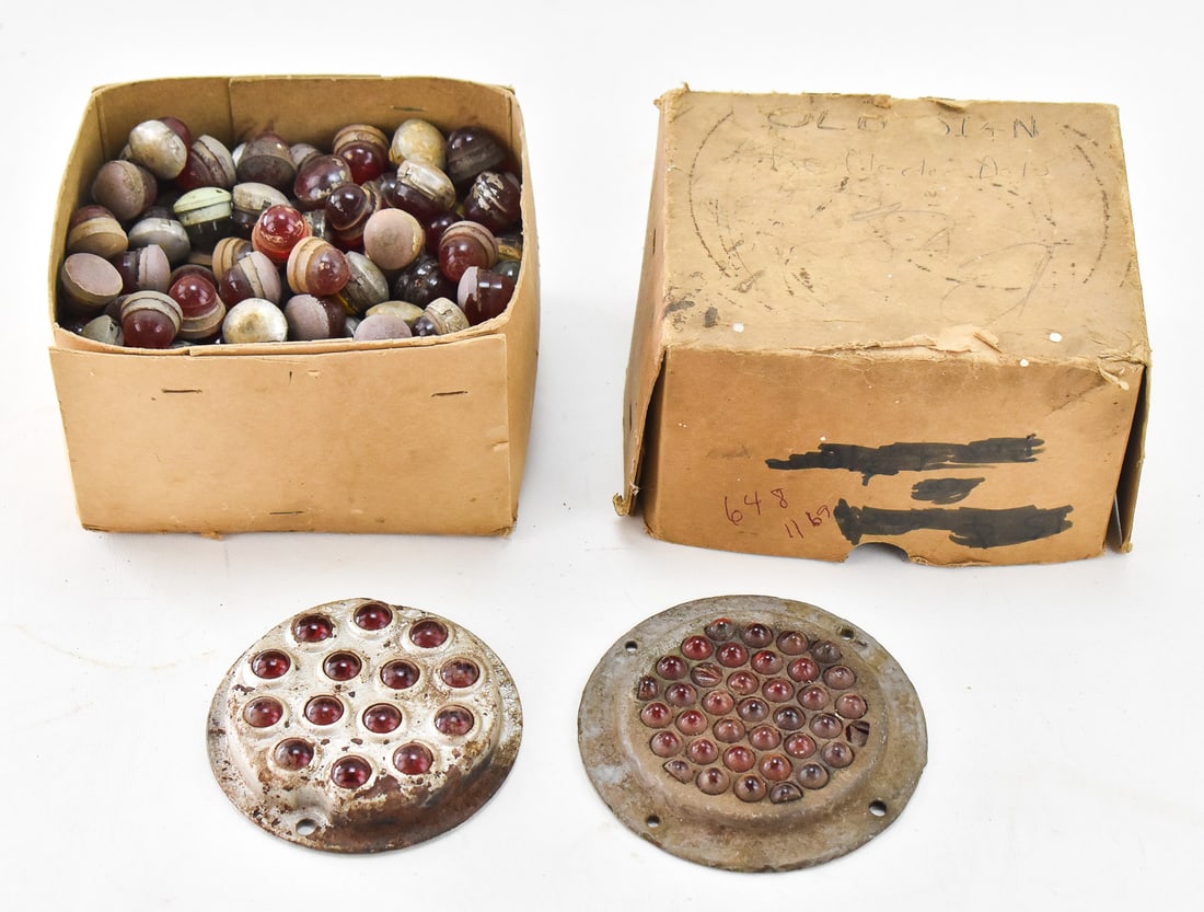 GLASS CATS EYE REFLECTORS WITH ADDITIONAL GLASS MARBLES: This lot includes two glass cats eye reflectors with a box of additional glass marbles, circa early 20th century. The largest item measures 4.5" H, 7" W, 6" D.