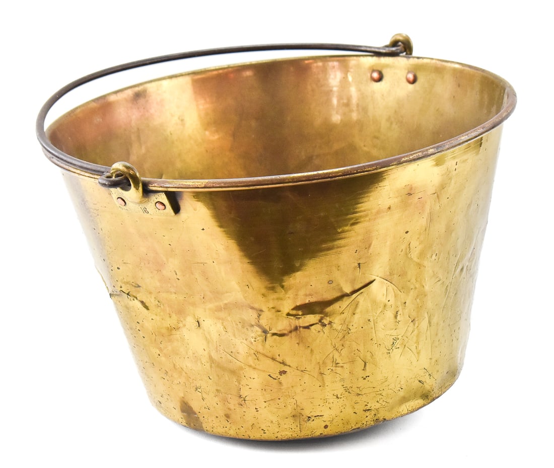 BRASS KETTLE NO. 16, AMERICAN BRASS KETTLE MANUFACTURERS: A large brass kettle number 16 manufactured by the American Brass Kettle Manufacturers. Marked "16" on each handle bracket. The kettle measures 11" H x 18.5" W x 17" D.