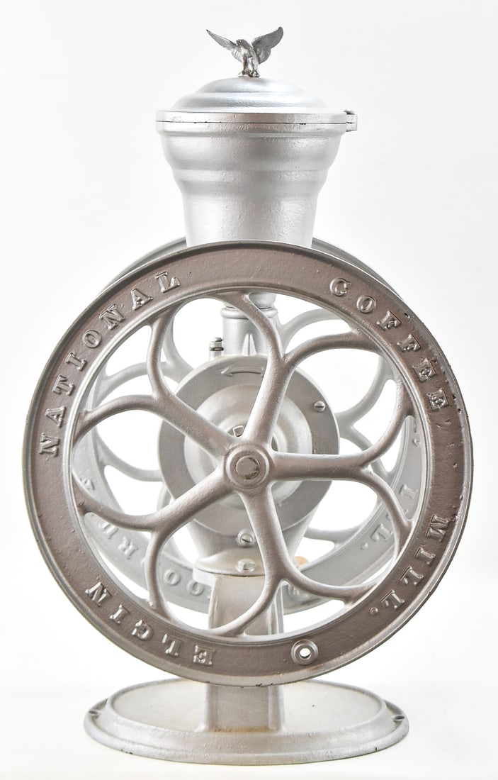 ELGIN NATIONAL COFFEE MILL GRINDER No. 42, C. 1890s: An Elgin National Coffee Mill No. 42 coffee grinder, manufactured circa 1890s. The coffee grinder is made of cast-iron with two wheels, an oval base, and has a swivel lid with an eagle finial. The